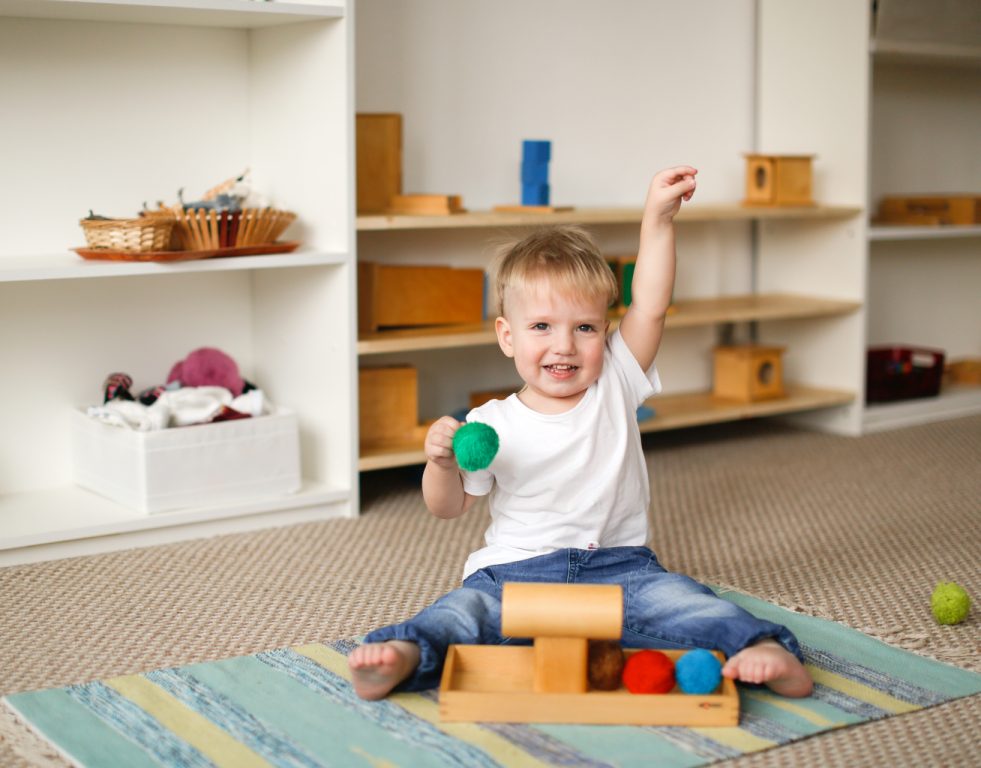 Child,Toddler,Plays,With,Balls,And,Cylinders,,Developing,Sensory,Activities